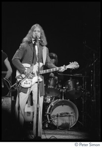 T-Bone Burnett playing Rickenbacker guitar on stage at the Harvard Square Theater, Cambridge, with the Rolling Thunder Revue