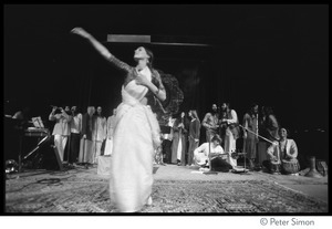 Woman dancing on stage at the Kohoutek Festival of Consciousness, with unidentified musicians