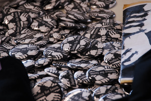 Justice for Jason rally at UMass Amherst: buttons and fliers in support of Jason Vassell