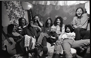 Holy Modal Rounders at home: from left, Robin Remaily, Richard North, Ted Deane, Peter Stampfel, Richard Tyler (child on lap), Steve Weber, and Dave Reisch