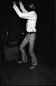 Beach Boys at Boston College: Mike Love raising a keyboard above his head