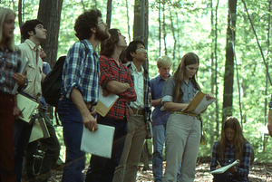 Biology 201 - Ecology field lab in the Hopkins Forest sugarbush. Matthew Cole, Williams Class of 1980, (second from left, in tan shirt), Peggy Dusenbury, Williams Class of 1980, (8th from left, in blue checked shirt), Debbie Gregg, Williams Class of 1982, (9th from left, seated in blue plaid shirt) and Taber Allison (far right).