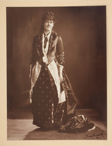 Alice Pearse wearing a red satin ensemble
