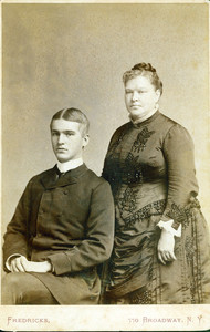 Three-quarter double studio portrait of Ellen Holt Bowen and Paul Holt Bowen, facing front, location unknown