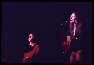 Judy Collins: performing on stage with drummer Susan Evans (tinted red)