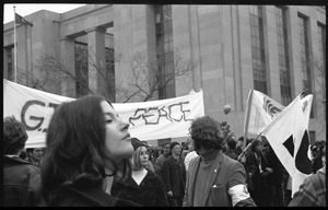 Woman in front of a GIs for Peace banner marching in the Counter-inaugural demonstrations, 1969, against the War in Vietnam