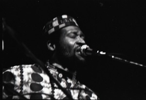 Taj Mahal in concert at Northfield, Mass.: Taj Mahal seated, singing