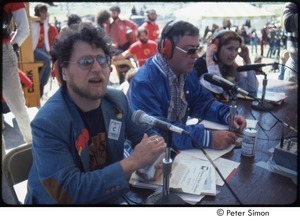 MUSE concert and rally: Danny Schechter (l) with two unidentified journalists