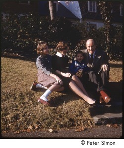 Carly, Lucy, Peter, and Richard Simon outside their family home