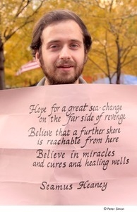 Occupy Wall Street: demonstrator holding sign with a Seamus Heaney poem