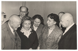 W. E. B. Du Bois and Shirley Graham Du Bois talking with unidentified men and women