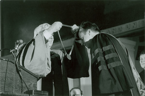 David C. Knapp receiving medal from unidentified man
