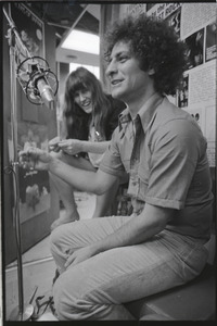 Abbie Hoffman: unidentified woman and Hoffman in WBCN studio (left to right)