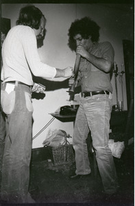 Abbie Hoffman Hoffman (right) smoking a bong of marijuana at WBCN studio