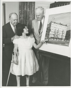Jeremiah Milbank Sr. and Bruce Barton with a young ICD client in front of an illustration of prospective building plans