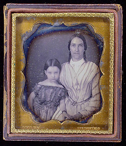 Half-length frontal portrait of an adult female and young girl