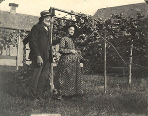 Mr. and Mrs. Abram Osborne at a famous grapevine