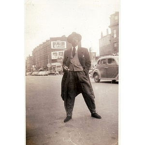 An unidentified man poses in front of Slade's Barbeque Chicken restaurant on Tremont Street