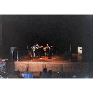 Two musicians performing at the Jorge Hernandez Cultural Center.