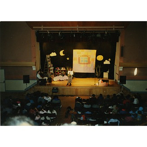 View from above of a children's play being performed for an audience at the Jorge Hernandez Cultural Center.