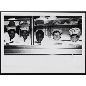 Members of the Tom Pappas Chefs' Club pose for a candid shot in a Brandeis University kitchen