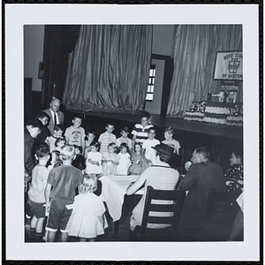 Contestants standing in front of the panel of judges, including John W. Sears, at center, during a Boys' Club Little Sister Contest