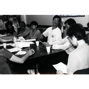 CPA members talking at a Workers' Center meeting