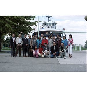 Chinese Progressive Association members gather in front of the "Thomas Rennie" boat