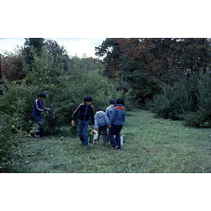 People in an orchard on a Chinese Progressive Association trip