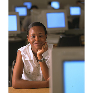 Student on co-op poses with computers