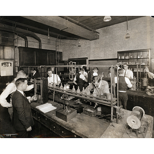 Chemistry students performing technical analysis in a laboratory