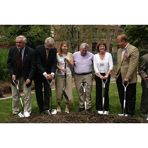 Six people hold shovels at the Veterans Memorial groundbreaking ceremony