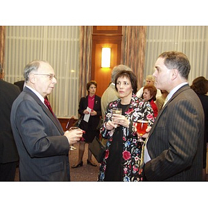 Group of participants, including award recipient Joseph Malarny (CBA '82) on right, talking before College of Business Administration's Distinguished Awards ceremony