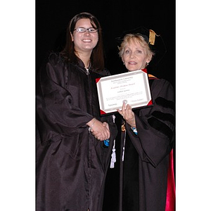 Dean Carole Kenner presents Colleen Gerrity with an award at the School of Nursing convocation ceremony