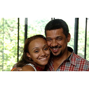 Torch Scholar Melanie Arvajo and a man pose together during move-in