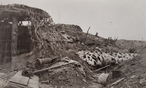 Exterior view of a camouflaged bunker and debris, outside Fort Douaumont