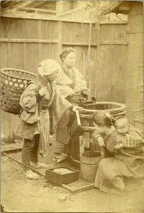 Japanese women at water barrel