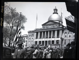 Welcome home ceremony for Richard Byrd at the Massachusetts State House following his Antarctic Expedition: crowd in front of State House and banner reading "Welcome Admiral Byrd"