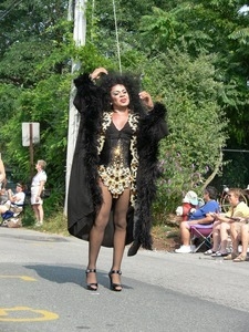 Parade marcher dressed like Diana Ross : Provincetown Carnival parade