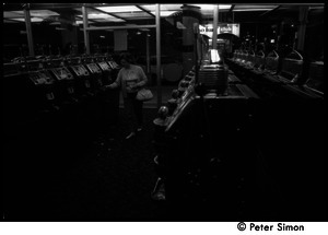 Woman playing slot machines in a casino