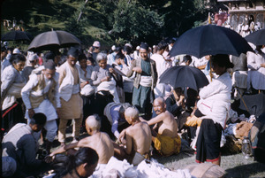 Crowds watch as priests prepare food in Gokarna