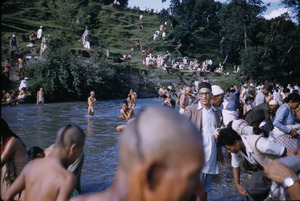 Priests and others bathe in river