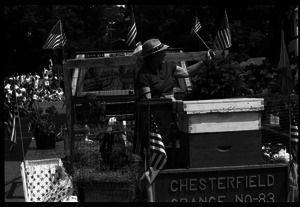 Chesterfield Grange float with beehives, a calf, and ducks at Chesterfield's Fourth of July parade