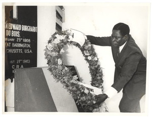 Unidentified minister of the Ghanaian government lays a wreath at the graveside of W. E. B. Du Bois