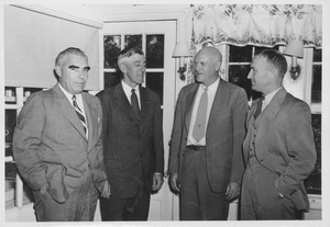 Ralph A. Van Meter standing with a group of men