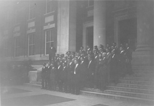 Group singing on steps of Stockbridge Hall