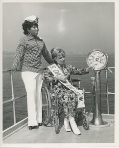 Mrs. Day in the sun on bridge of ship