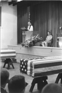 Funeral service for two U.S. Embassy victims of bombing. Coffins of embassy victims carried by U.S. Embassy officials and Navy guards; Saigon.