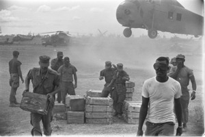 Marines loading supplies aboard helicopters for the front.