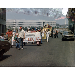 People march in a parade near Center Plaza during the Festival Puertorriqueño